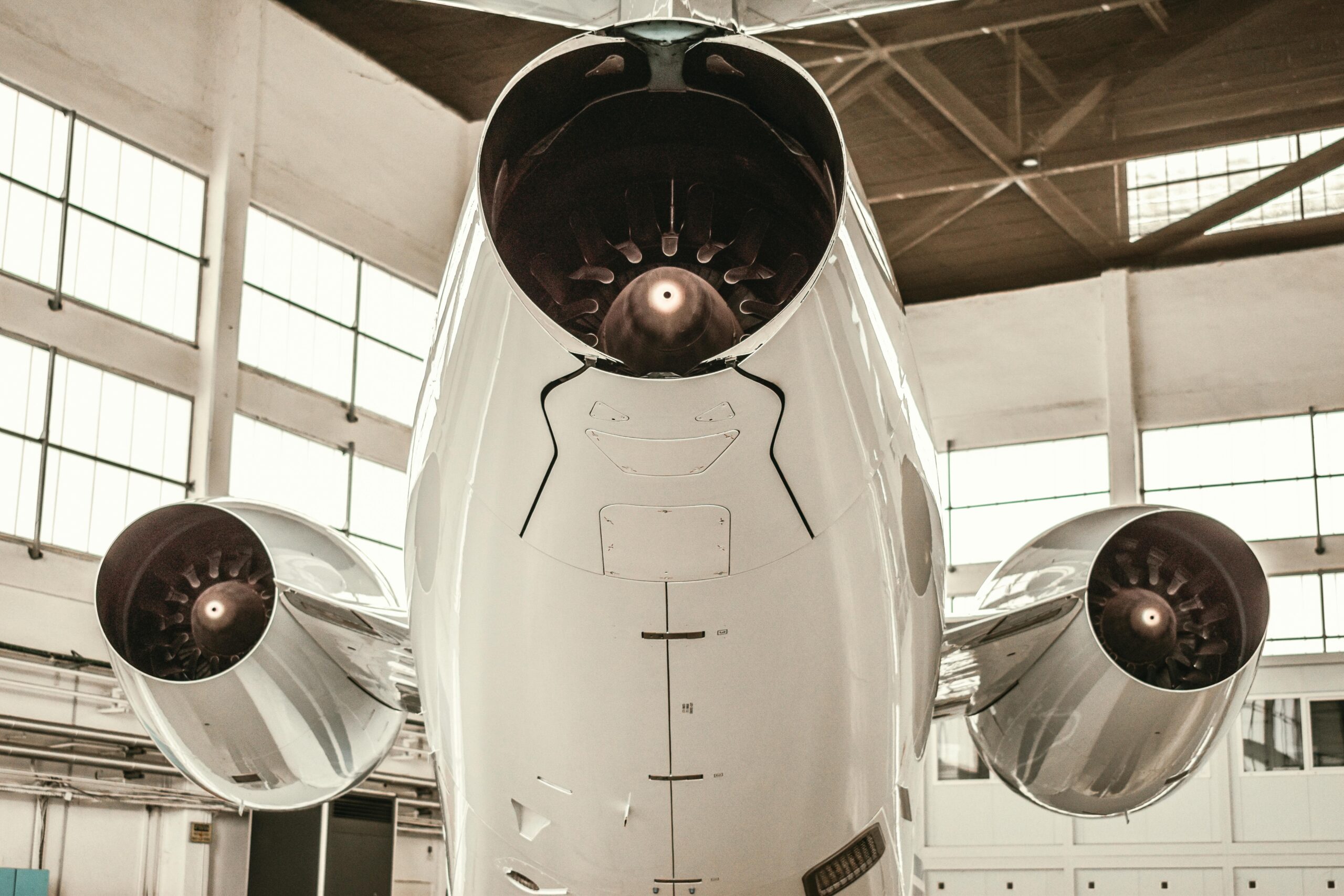 Close-up of aircraft jet engines displayed inside a hangar in Paris, France.