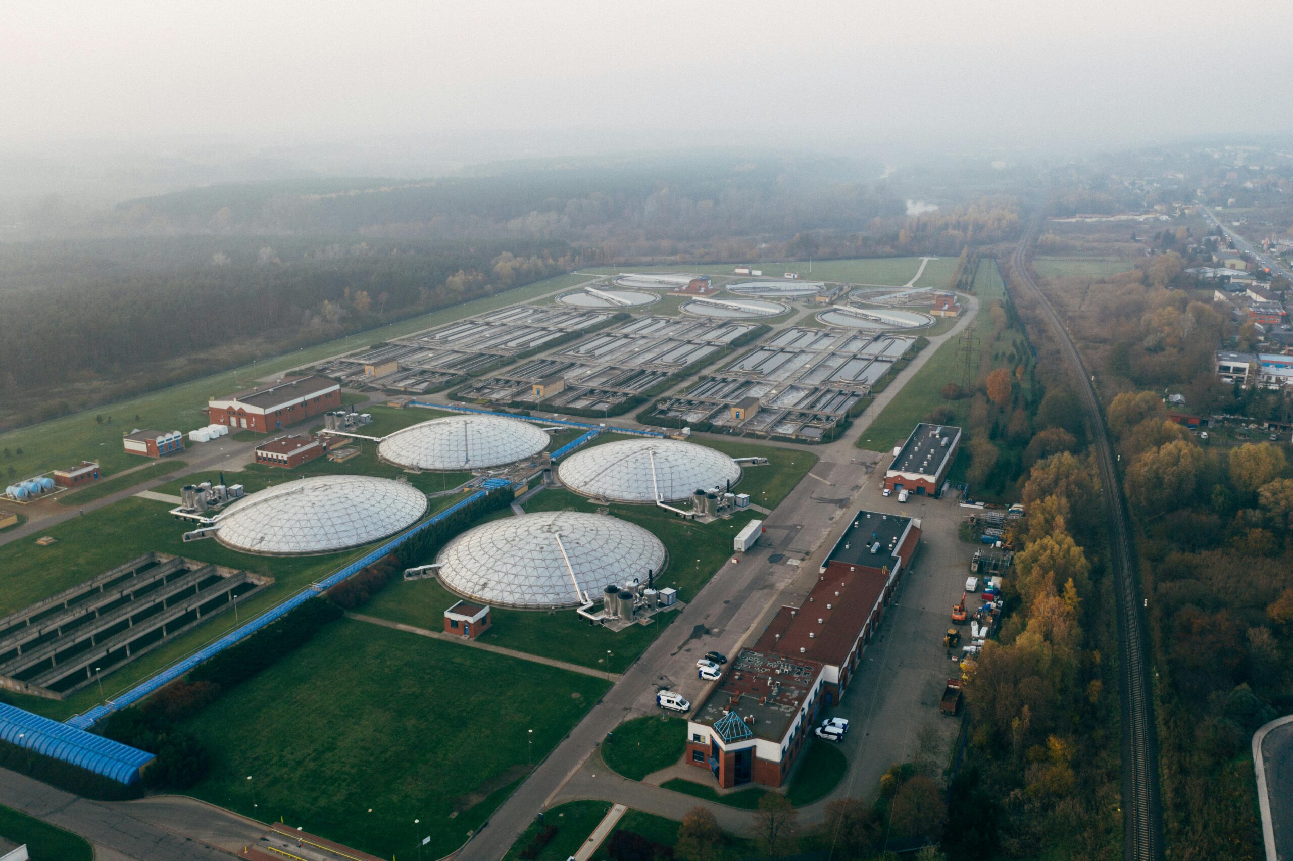 Aerial shot of a wastewater treatment facility in Poznań, showcasing industrial technology and environmental effort.